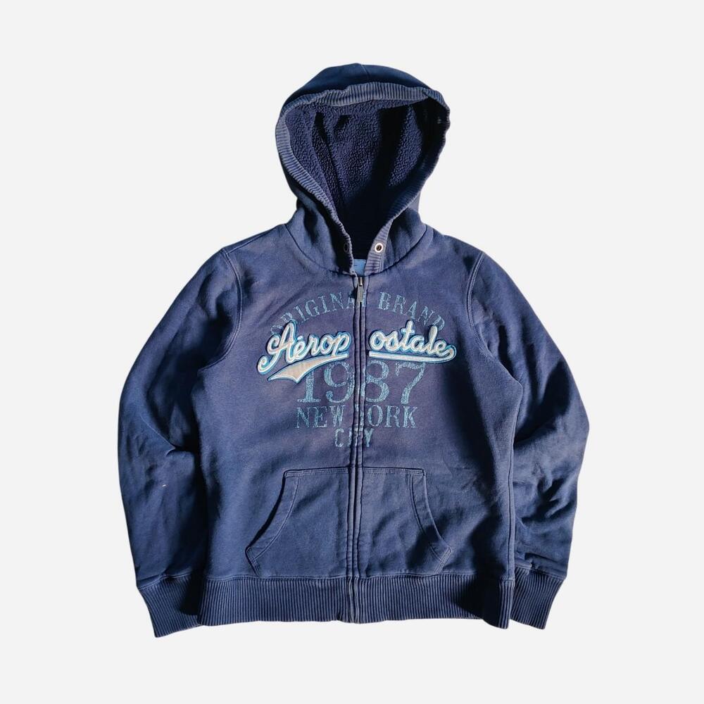 Navy blue Aeropostale Sherpa lined zip-up hoodie with white text graphic reading